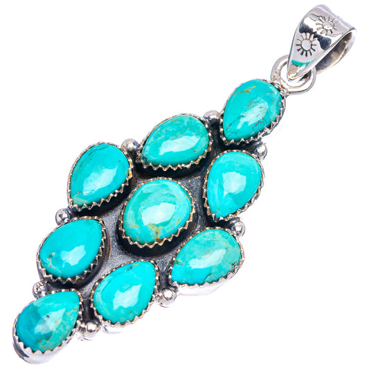 Turquoise cluster pendant, oval cabochons in black, with decorative silver bail