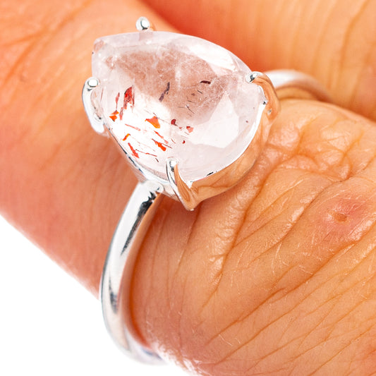 Sterling silver ring with pear-cut clear gemstone and red inclusions