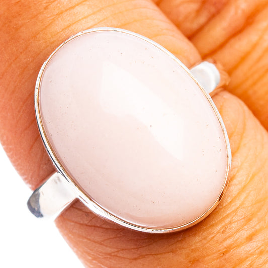 Oval pink opal bezel ring in .925 sterling silver with smooth band