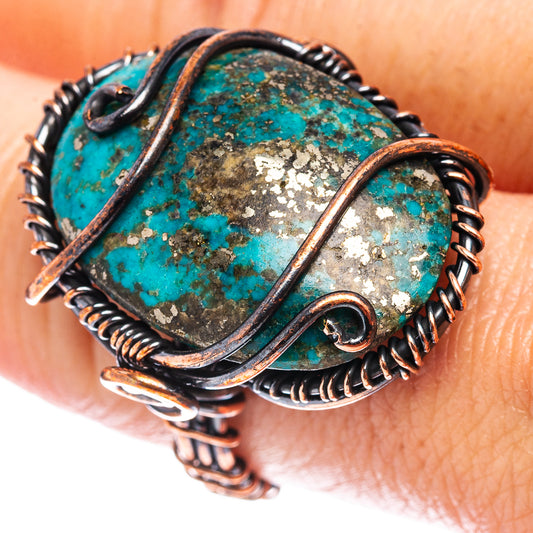 Turquoise wire wrap ring with oxidized copper wire and oval turquoise stone detail