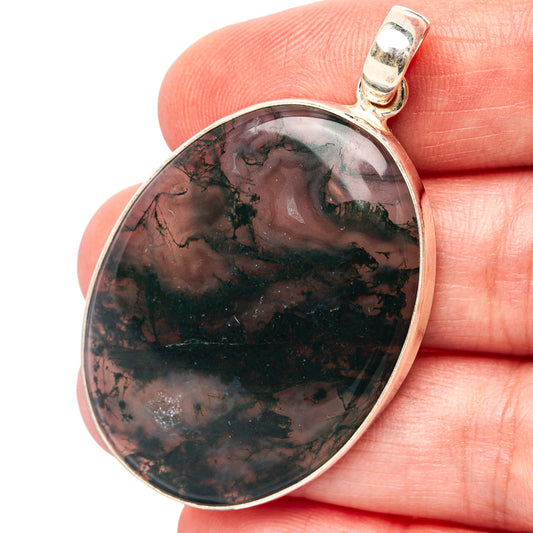 Oval moss agate pendant with dark green and black stone, sterling silver bezel