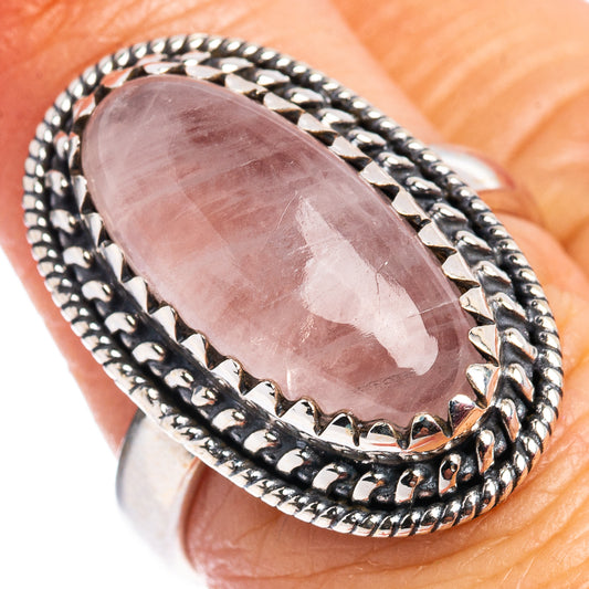 Oval rose quartz cabochon ring with braided .925 sterling silver frame