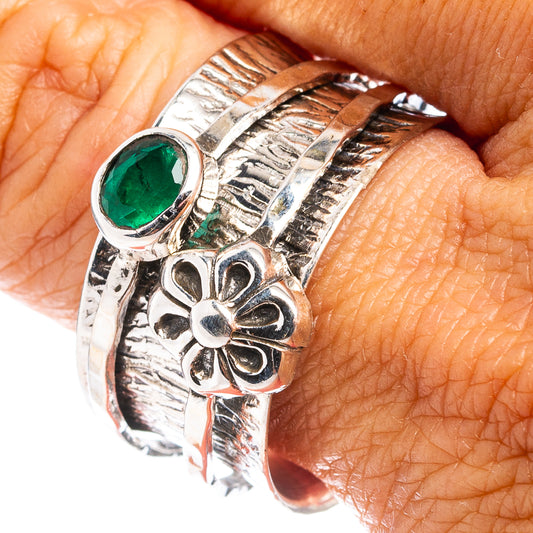 Sterling silver emerald ring with oval green gemstone and engraved floral details