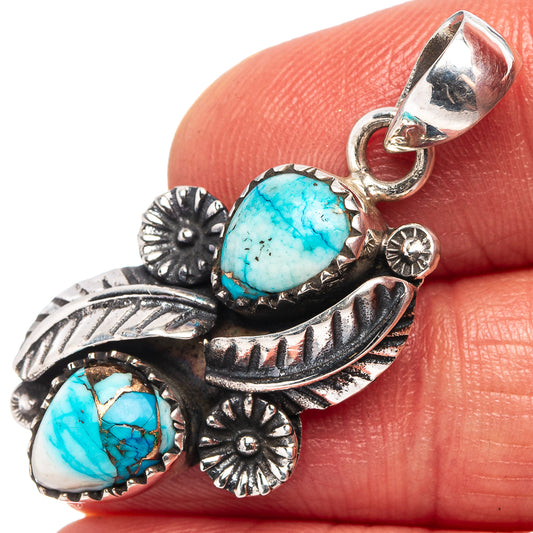 Turquoise cabochon pendant in .925 sterling silver with ornate floral leaf setting