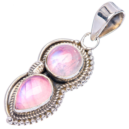 Pink moonstone pendant with oval pink cabochon stone and bead-textured .925 silver bail