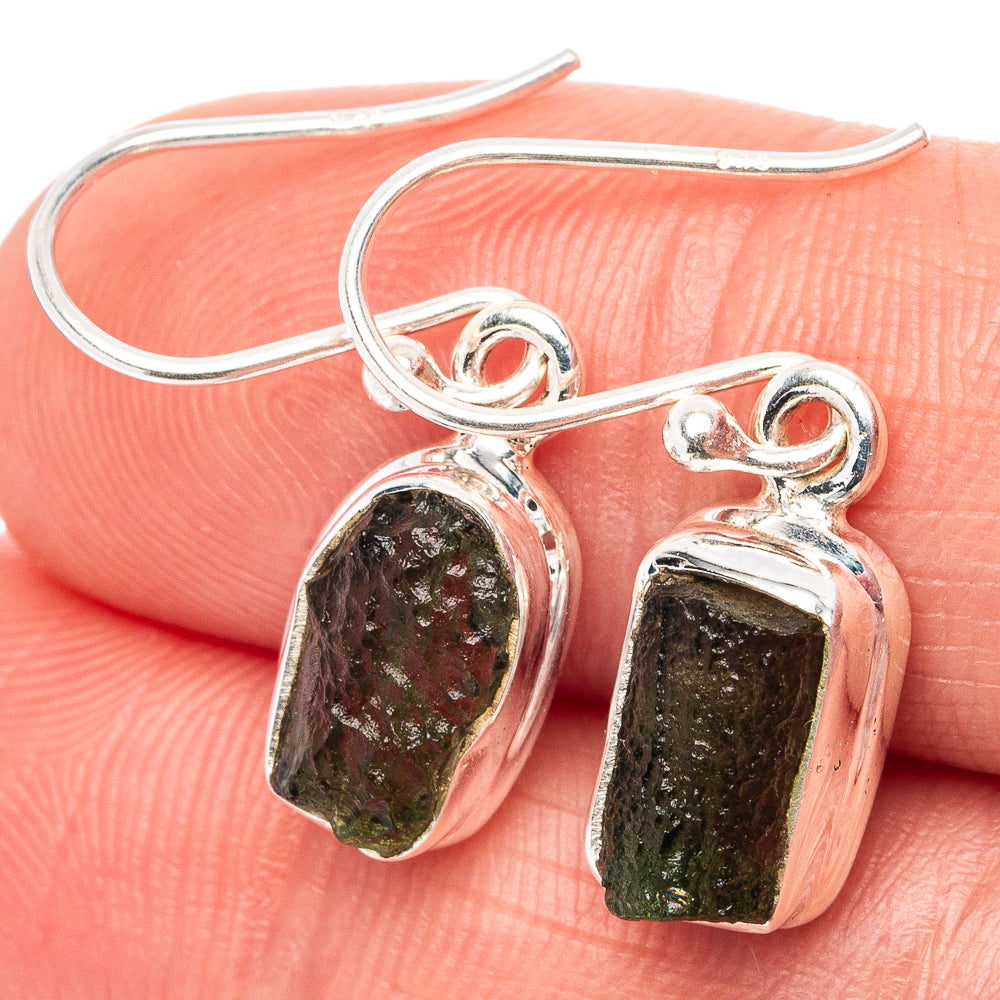 Sterling silver dangle earrings with raw dark green moldavite stones, textured frames