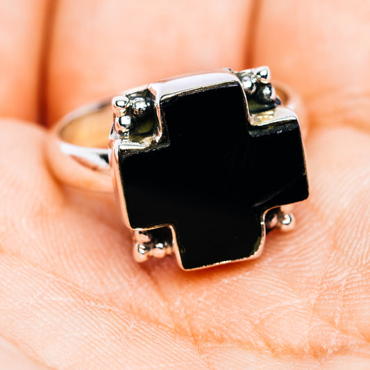 Sterling silver ring front view with square black onyx cross bezel and side prongs