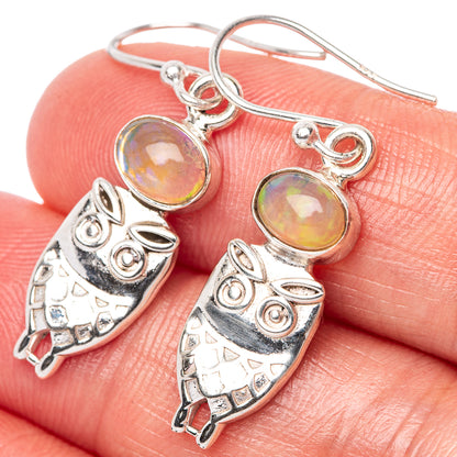 Sterling silver owl earrings with oval iridescent opal-style cabochons