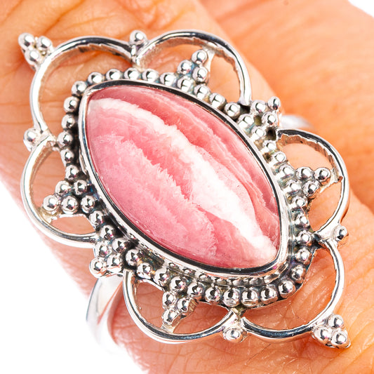 Oval pink rhodochrosite ring with .925 sterling silver bezel and beadwork border
