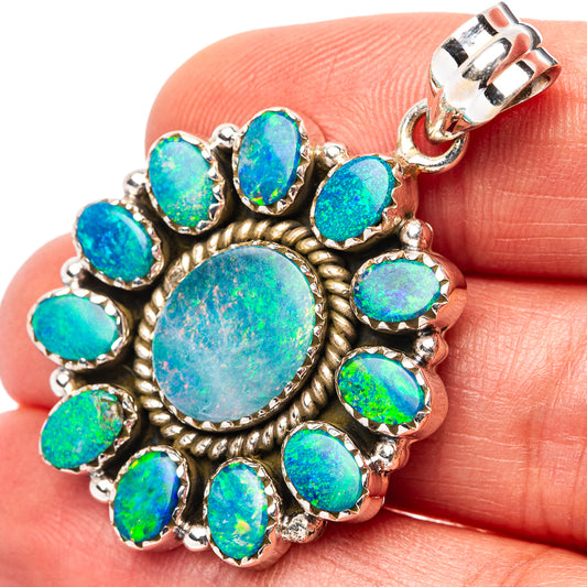 Sterling silver opal doublet pendant, oval center with blue-green stone halo