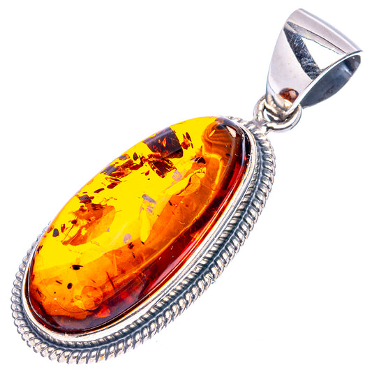 Oval amber pendant in .925 sterling silver bezel, golden yellow-orange cabochon.