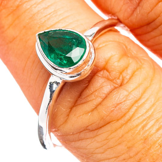 Oval green emerald gemstone sterling silver ring on finger