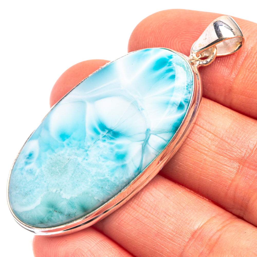 Sterling silver larimar pendant with oval blue stone in bezel and loop bail