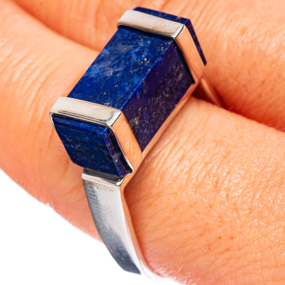 Sterling silver ring with rectangular lapis lazuli gemstone, blue facets in split prongs