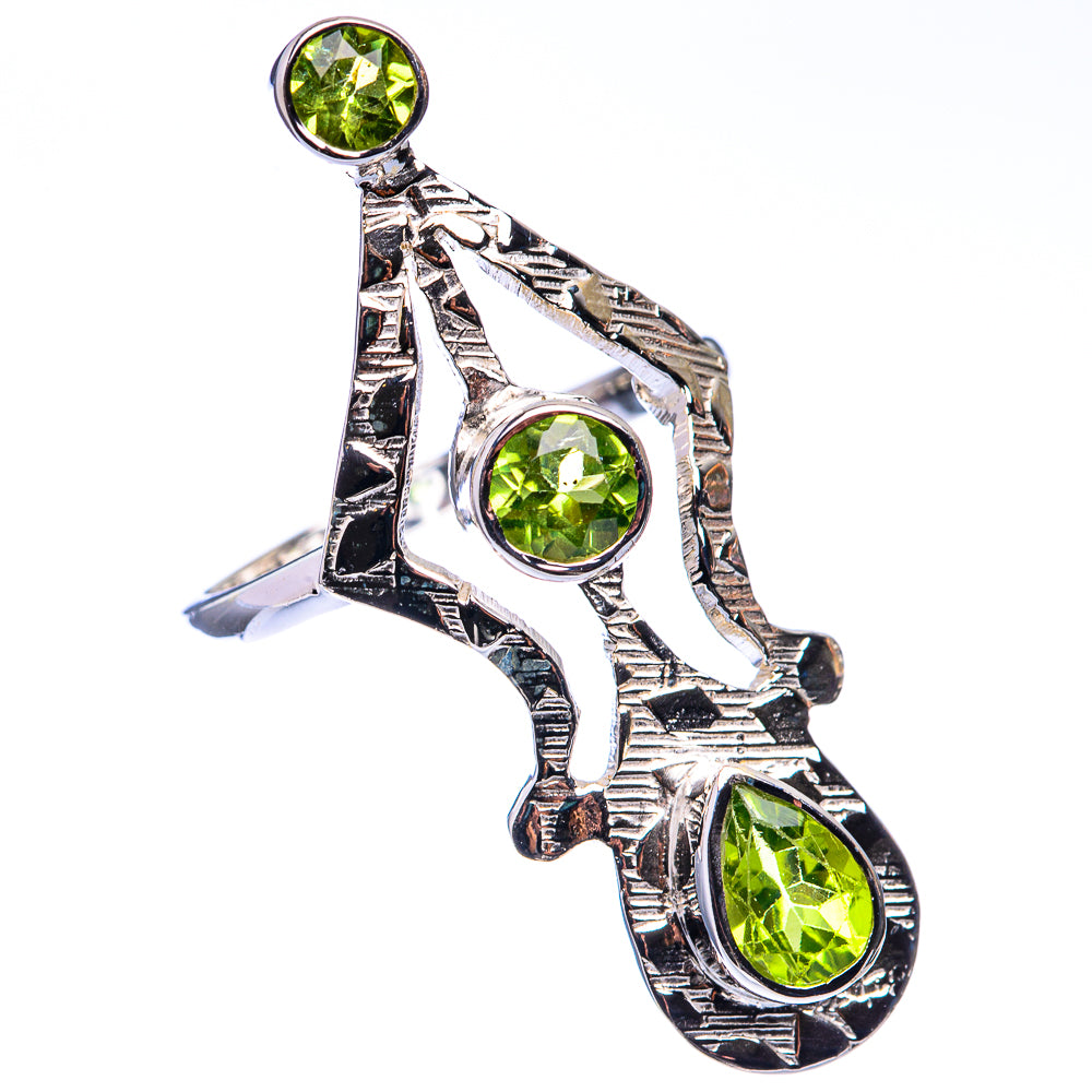 Sterling silver peridot ring, three round green stones in ornate split-band setting