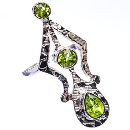 Sterling silver peridot ring, three round green stones in ornate split-band setting