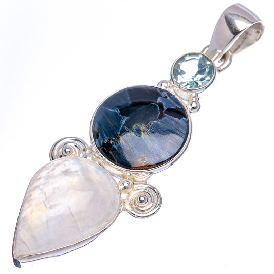 Sterling silver pendant with dark blue oval gemstone, pale pear stone, and sky-blue accent