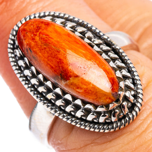 Oval orange sponge coral cabochon sterling silver ring, rope-edge bezel
