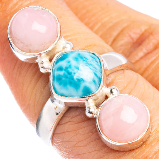 Sterling silver ring with three cabochon stones: pink and blue center, pink