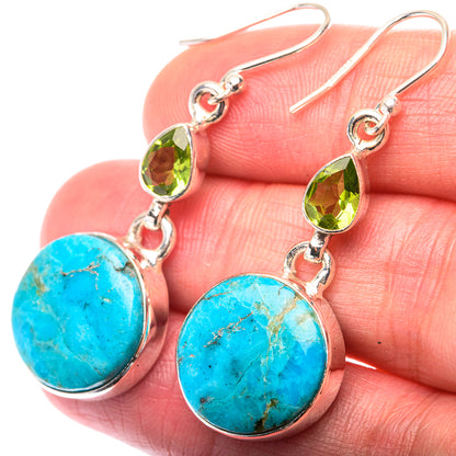 Sterling silver drop earrings with turquoise oval cabochons and green teardrop crystals