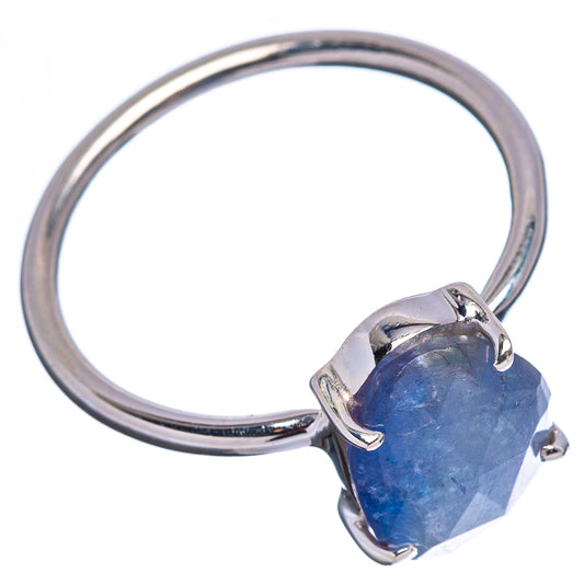 Sterling silver ring with oval blue faceted gemstone in four-prong setting