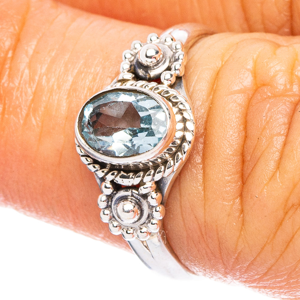 Oval blue topaz gemstone sterling silver ring with ornate filigree setting
