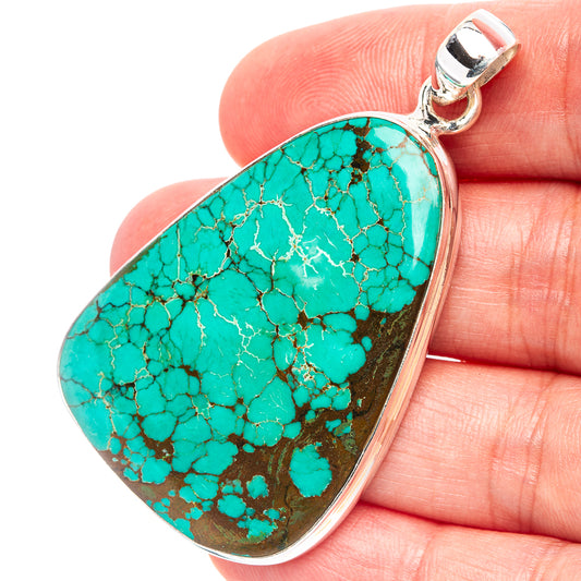 Turquoise heart-shaped pendant in .925 sterling silver bezel with bail