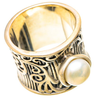 Cultured pearl ring with two round white pearls on ornate metal band