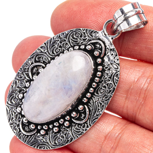 Rainbow moonstone pendant, oval German-silver setting with filigree and bail