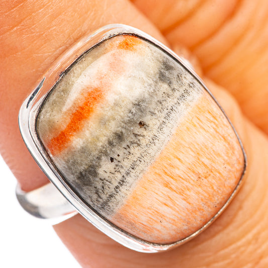 Sterling silver oval cabochon ring with orange and gray speckled stone