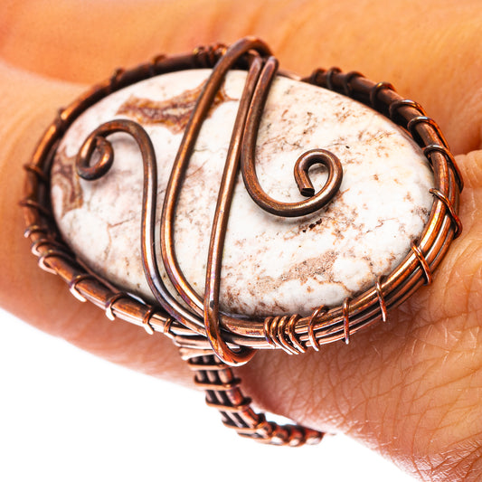 Oxidized copper wire ring with oval white-and-brown jasper and swirling wirework