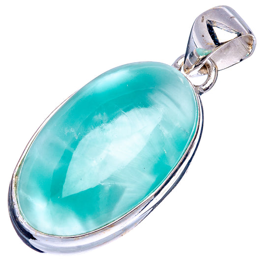Oval turquoise gemstone pendant in .925 sterling silver bezel with top bail loop