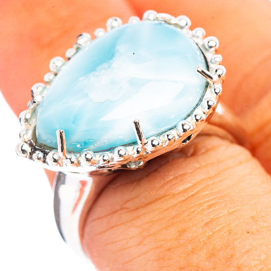 Sterling silver larimar ring with oval light-blue stone and beaded halo setting