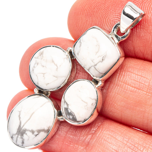 Howlite cabochon sterling silver pendant with four oval stones, polished bezel