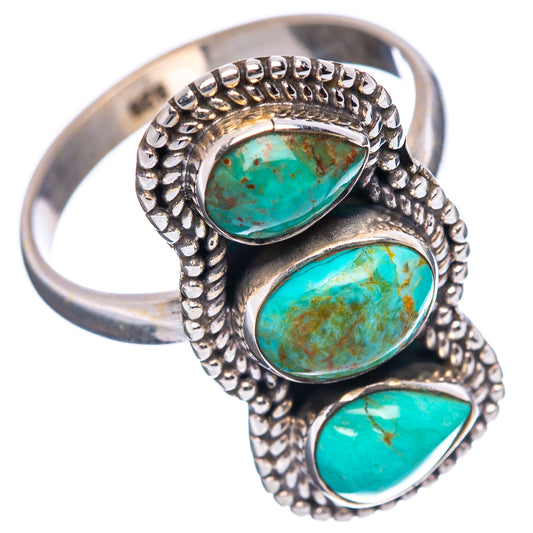 Turquoise three-stone sterling silver ring with oval stones and textured bead setting, side view