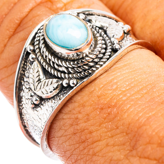 Sterling silver cocktail ring with round blue larimar cabochon and engraved side details