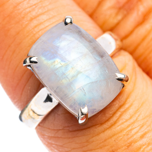 Sterling silver moonstone ring with oval rainbow cabochon, four silver prongs