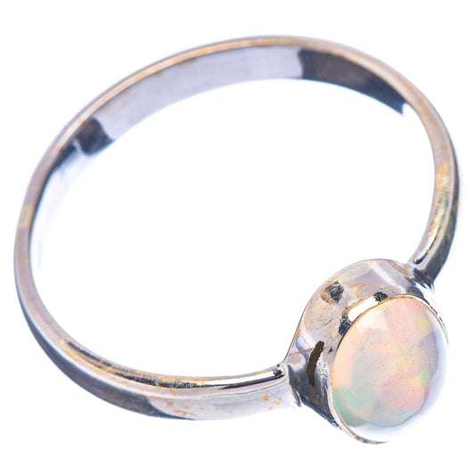 Sterling silver opal ring with oval bezel set on a split shank