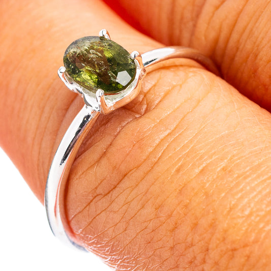 Faceted green moldavite stone sterling silver ring with round bezel setting