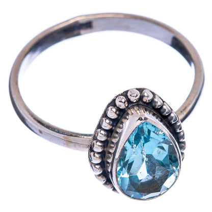 Sterling silver blue topaz oval ring with beaded halo and prong setting