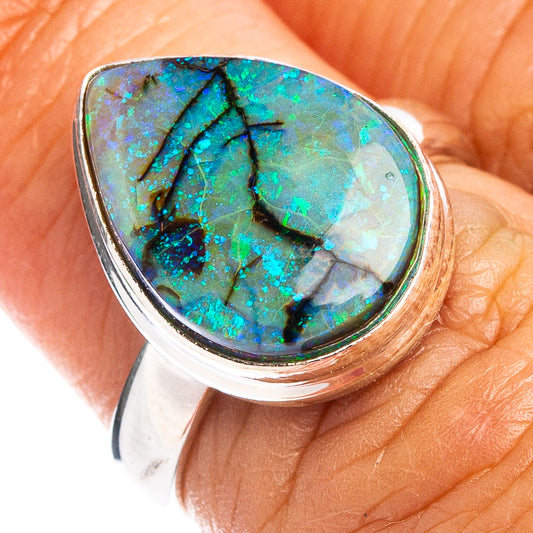 Teardrop opal ring bezel in sterling silver, close-up of blue-green stone