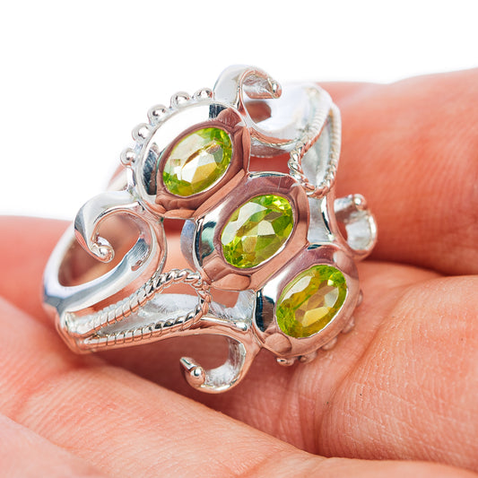 Three-stone peridot ring in .925 sterling silver with three round green gemstones