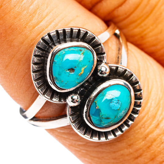 Turquoise oval ring in .925 silver sunburst bezel, worn on finger