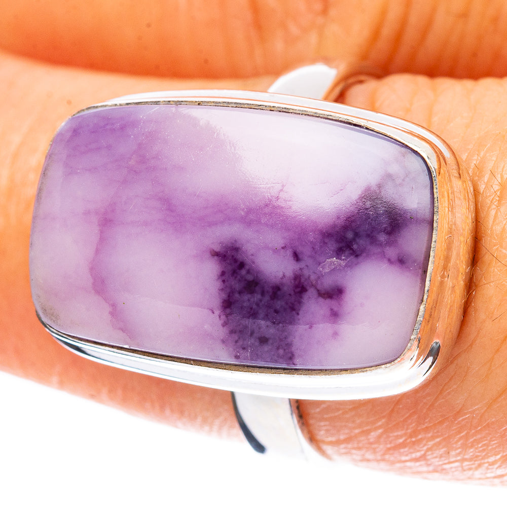Oval purple Tiffany stone cabochon set in silver bezel ring