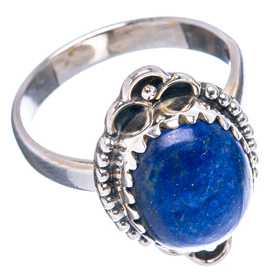 Sterling silver ring with oval blue lapis stone, scalloped bezel and textured band