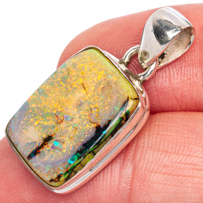 Sterling silver opal pendant with square bezel, orange-yellow iridescent stone