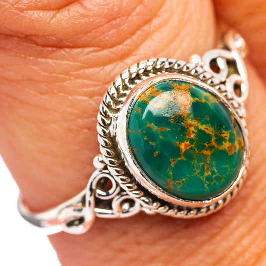 Turquoise cabochon sterling silver ring with ornate bezel, oval green stone