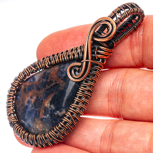 Oxidized copper wire-wrapped sodalite teardrop pendant, oval bail loop