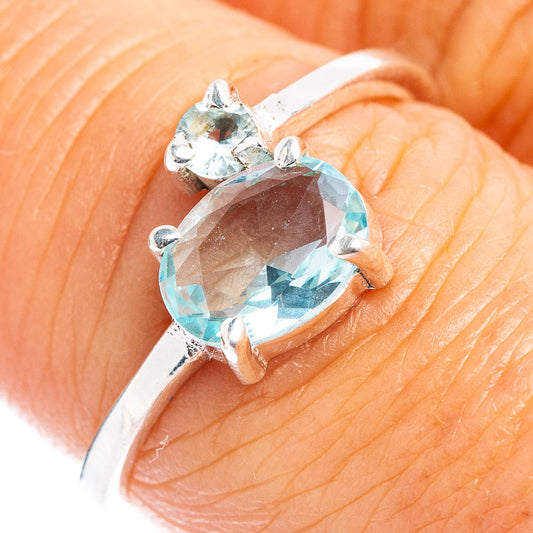 Blue topaz oval dainty ring in .925 sterling silver with side prongs