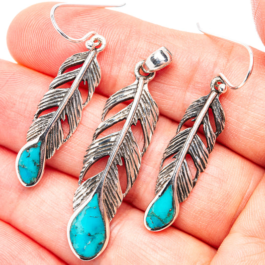 Turquoise feather dangle earrings with silver-tone leaf details